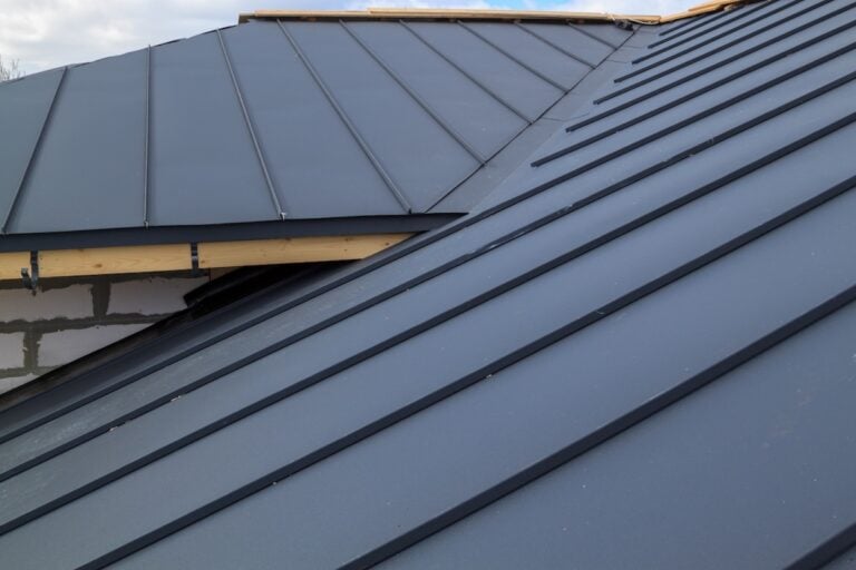 black standing seam metal roof slope