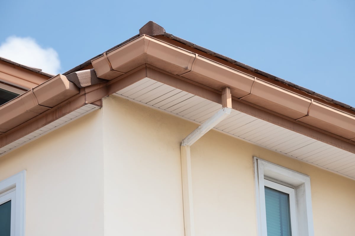 brown steel rain gutter with blue sky.