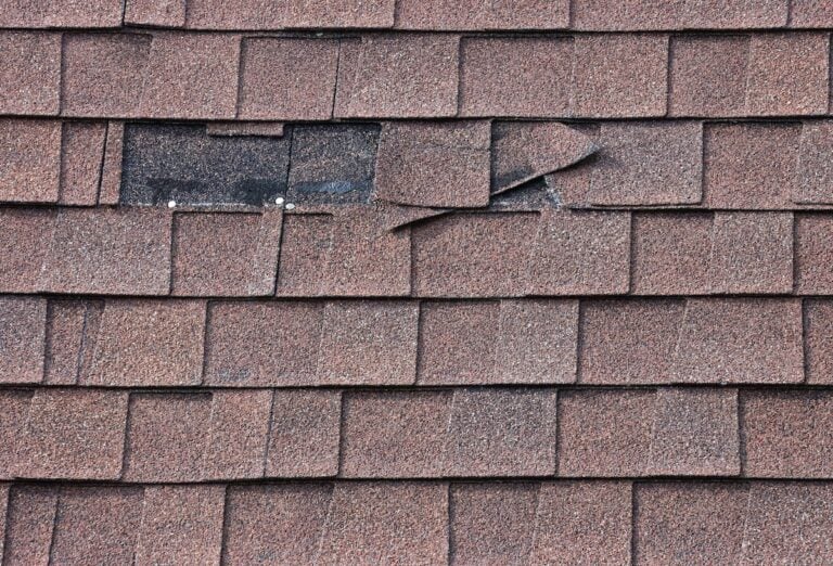 two Shingles Missing from Mansard Roof