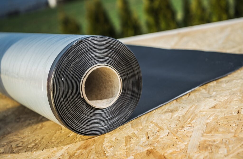 Roll of EPDM Ethylene Propylene Diene Terpolymer Material Laying on a Roof. Modern Roofing Materials.