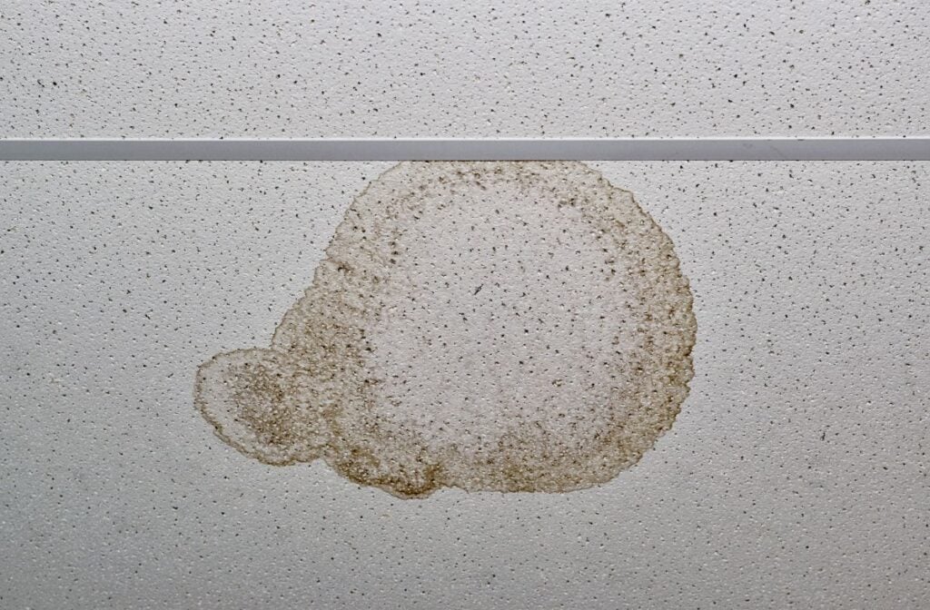 commercial roof leak detection yellow stain on ceiling