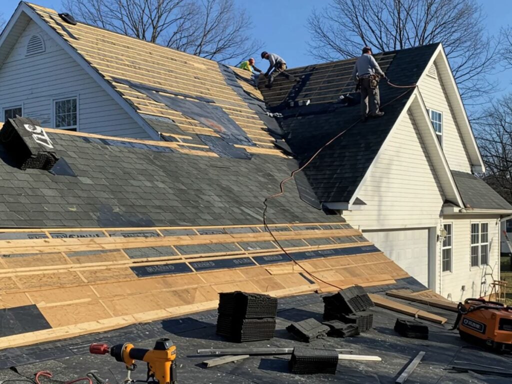 white glove experience worker from M&M replacing shingles