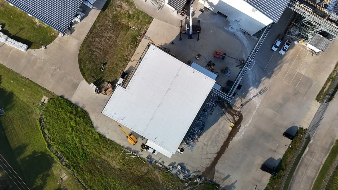 Overhead view of a white rectangular PVC roof at the FACI industrial facility in Lufkin