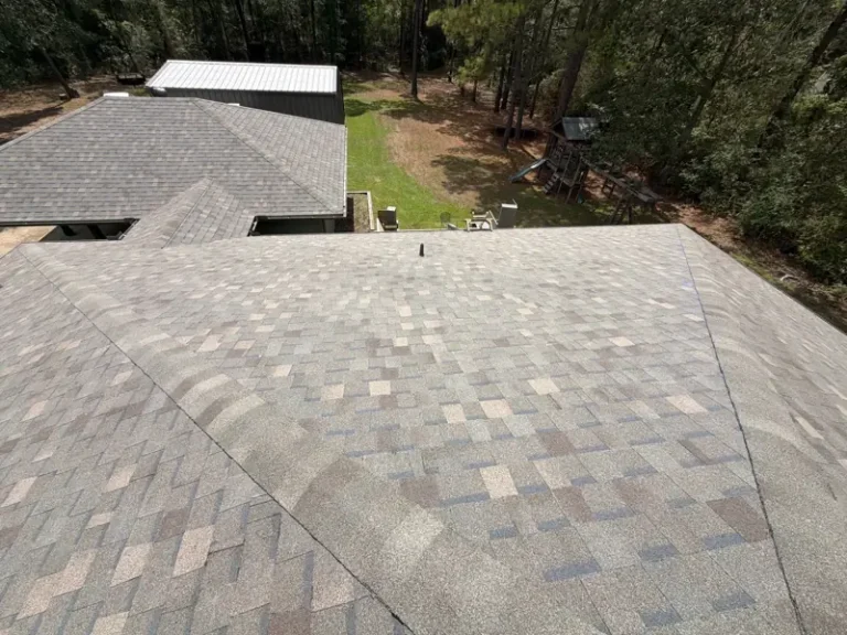 Finished architectural shingles across intersecting hip roof slopes at a Lufkin, Texas home