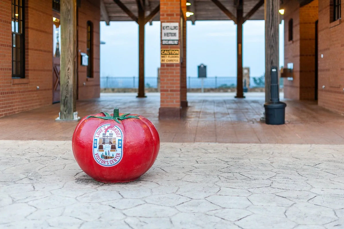 Concrete tomato sculpture in front of the visitor center at Love’s Lookout near Jacksonville, Texas.