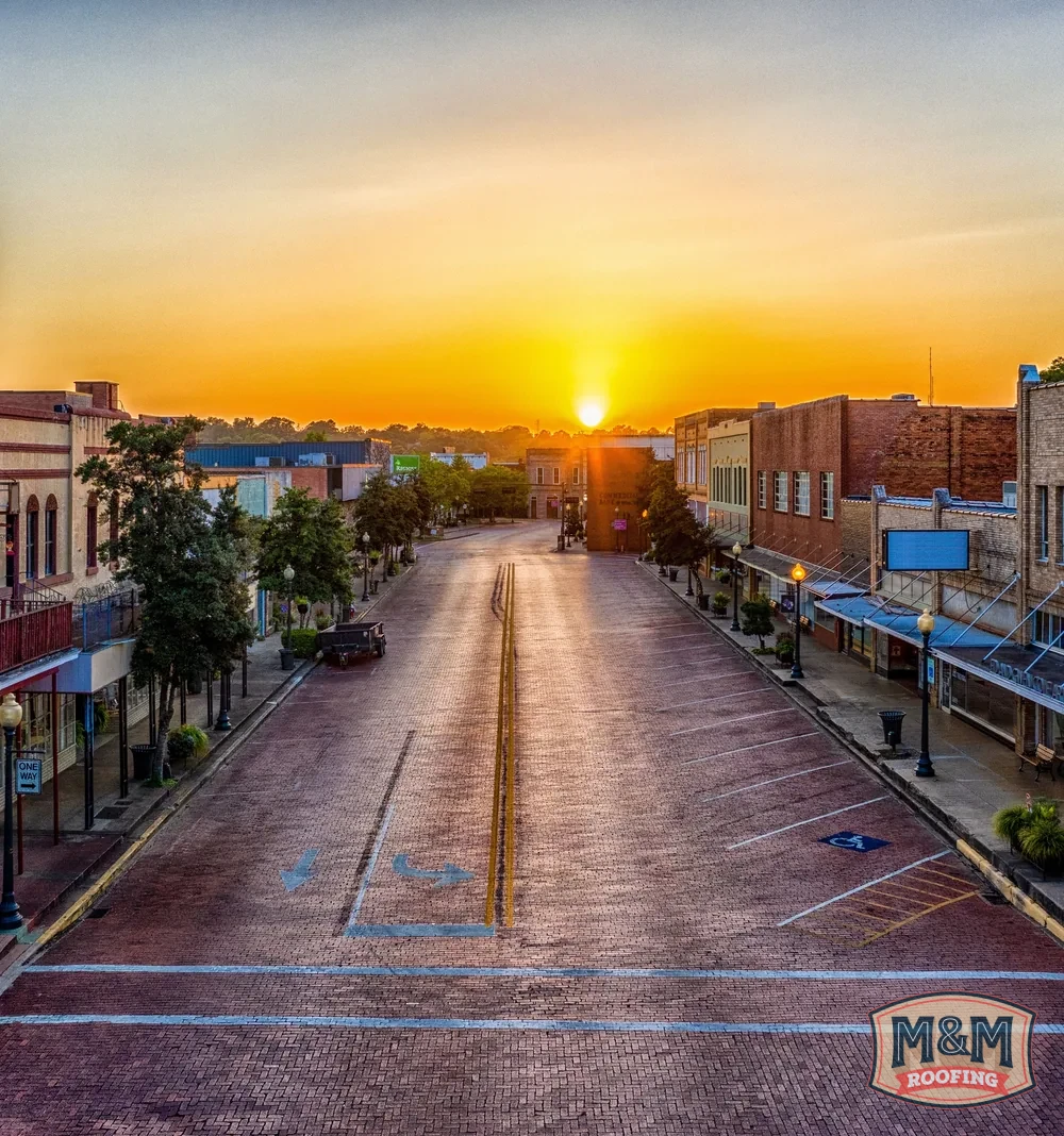 Sunset over the red brick streets and historic storefronts of downtown Nacogdoches, Texas